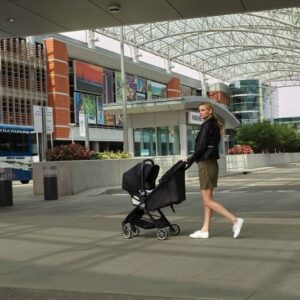 2081849-baby-jogger-city-tour-ICS-mom-and-baby-stroller-in-ICS-mode-with-talent-in-use-1