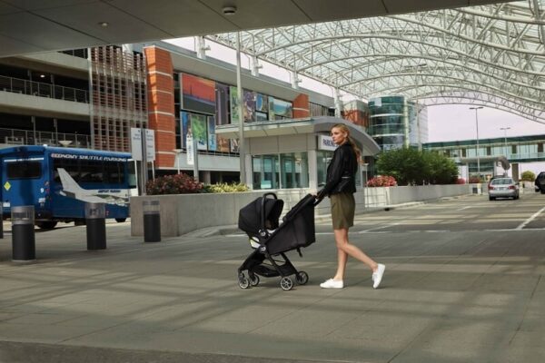 2081849-baby-jogger-city-tour-ICS-mom-and-baby-stroller-in-ICS-mode-with-talent-in-use-1